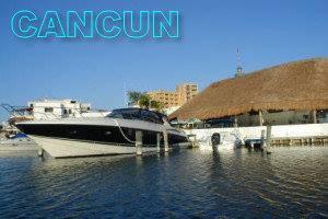 Luxury yachts, sailing catamarans and sport boats docked at a Cancun hotel-zone marina, ready for private Caribbean charters