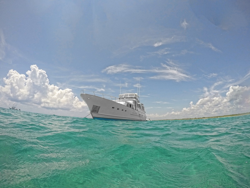 Classic 80ft Burger motor yacht charter at Puerto Aventuras marina, Riviera Maya