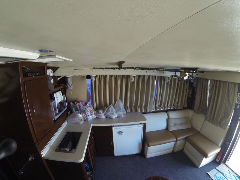 Hatteras 45 ft yacht deck guests boarding Puerto Aventuras marina Riviera Maya charter boat tour