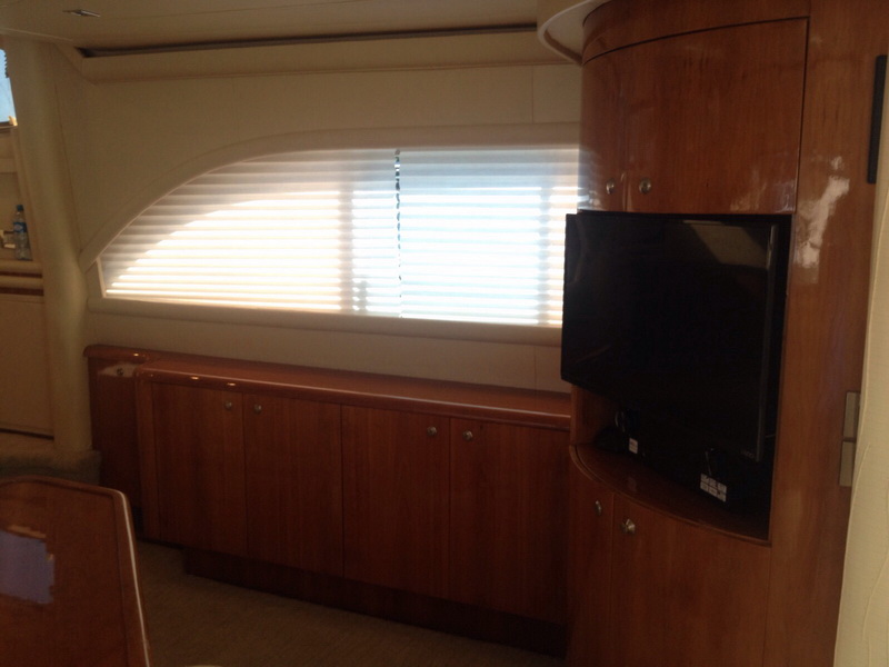 yacht rental group enjoying open-air deck on turquoise Caribbean waters, Puerto Aventuras